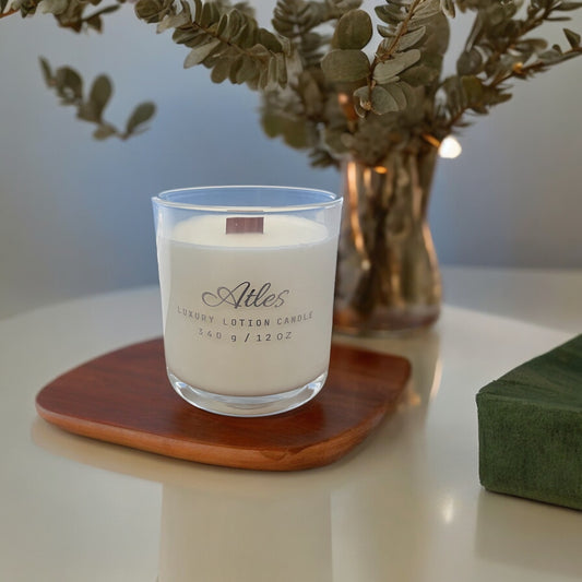 lotion candle in a clear glass jar